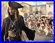 Johnny-Depp-Signed-Pirates-Of-The-Caribbean-11x14-Photo-BAS-Beckett-E49571-01-uu